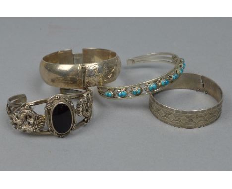 FOUR MIXED SILVER BANGLES, approximate weight 128 grams