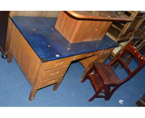 A MID CENTURY OAK KNEEHOLE DESK, and a reproduction metamorphic library step chair (2)