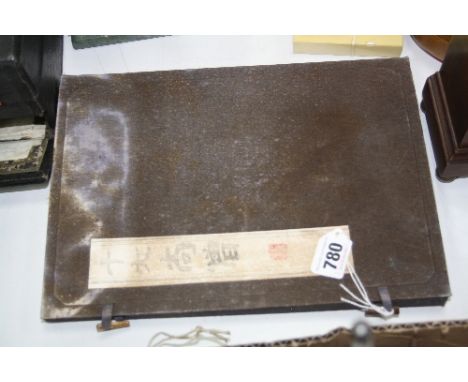 A CASE OF BLACK AND GILT MOULDED CERAMIC CHINESE DECORATIVE TILES