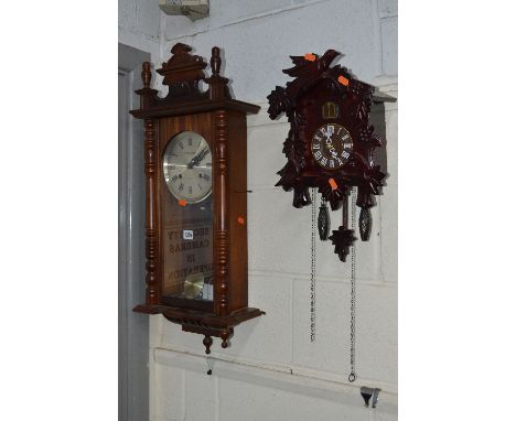 A MODERN MAHOGANY WALL CLOCK (pendulum) and a modern cuckoo clock (2)