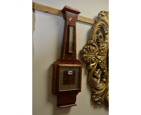 A MAHOGANY AND WALNUT ANEROID BAROMETER, signed R M Ramage Alloa