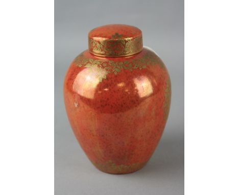 A ROYAL WORCESTER CROWN WARE ORANGE LUSTRE GINGER JAR, decorated in gilt with leaves, height approximately 14.5cm