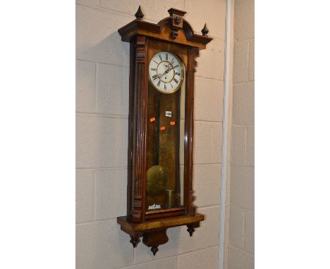 A VICTORIAN VIENNA WALNUT WALL CLOCK, the circular enamel dial with Roman numerals and subsidiary seconds dial, approximate h