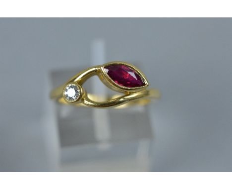 A MODERN 18CT GOLD RUBY AND DIAMOND ABSTRACT TWO STONE RING, one marquise cut ruby measuring approximately 8.30mm x 4mm, esti