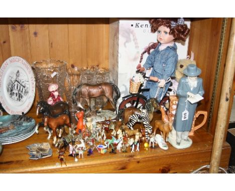 A GROUP OF CERAMIC AND GLASS ORNAMENTS and boxed Kensington giftware collectors doll on bicycle, to include Nao Jewish gentle