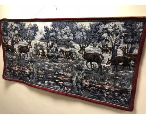 A 20TH CENTURY WALL TAPESTRY, of a pack of hounds hunting deer, approximate width 167cm x height 83cm