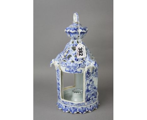 A DUTCH DELFTWARE TABLE LANTERN, ring handle (glued) above a pierced top with moulded lizards, the three open sides with slot