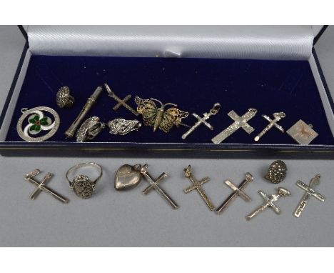 A TRAY OF MIXED SILVER CROSSES, rings, brooches, etc