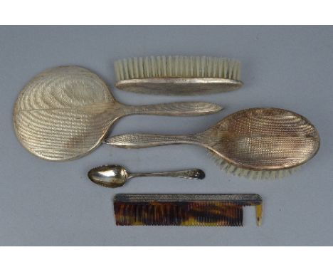 A FOUR PIECE SILVER BRUSH SET, and a teaspoon