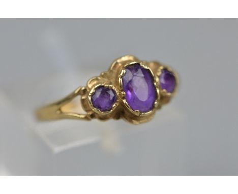 A 9CT AMETHYST THREE STONE RING, ring size L, approximate weight 2.0 grams