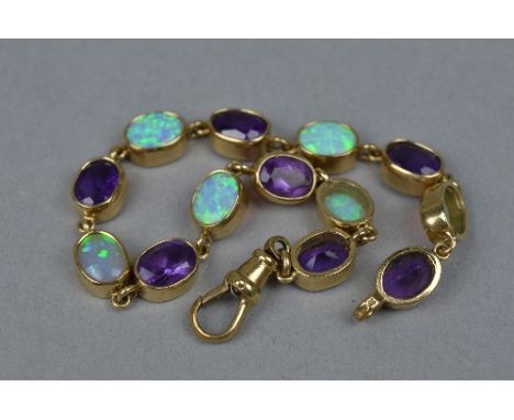 A MODERN 9CT GOLD AMETHYST AND SYNTHETIC OPAL BRACELET, oval gemstones measuring approximately 8.0mm x 6.0mm rub over set, br