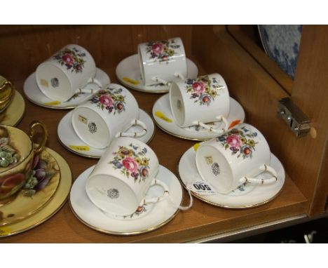 A SET OF SIX ROYAL WORCESTER COFFEE CANS AND SAUCERS, florally decorated