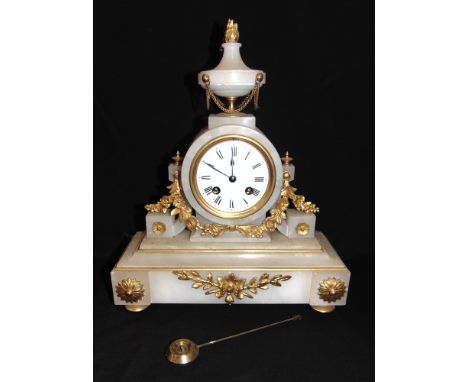 A FRENCH GILT METAL MOUNTED WHITE METAL CLOCK  the 8-day movement striking on a bell, 28cm wide