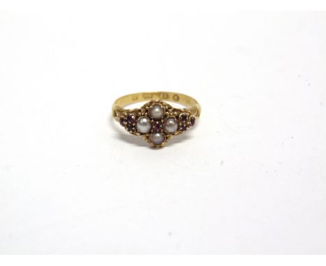 A MID-VICTORIAN 18CT GOLD, RUBY AND HALF-PEARL CLUSTER RING centred with a tiny ruby within a half-pearl quatrefoil between r