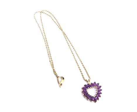 AN MODERN AMETHYST-COLOURED PASTE 'HEART' PENDANT AND A NECKLACE the openwork pendant claw set with 17 marquise shaped stones