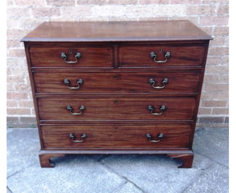 A GEORGE III MAHOGANY CHEST OF TWO SHORT AND THREE LONG DRAWERS  with line inlaid decoration, on bracket feet