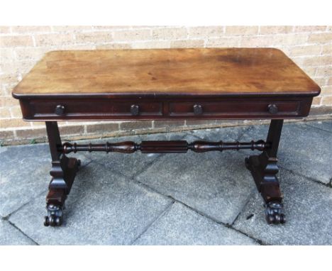 A VICTORIAN MAHOGANY SIDE TABLE  with two frieze drawers opposed by two dummy drawers, the supports united by turned stretche