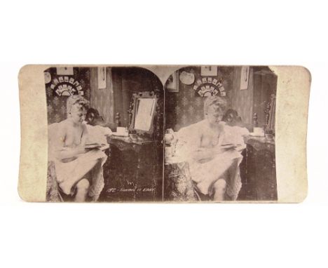 TWENTY-THREE STEREOSCOPIC VIEW CARDS  including one semi-nude; together with a mahogany hand-held viewer; and a Bond's table-