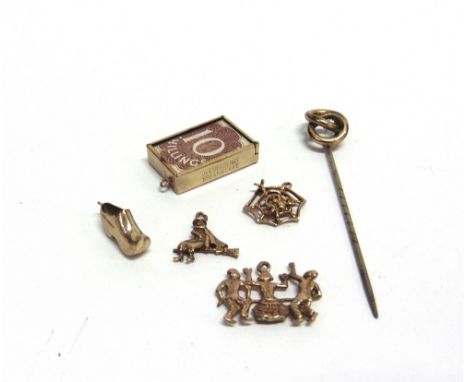 FOUR 9CT GOLD CHARMS  comprising; a clog; a witch on a broom; a spider's web; and three dancing figures, various dates and ma