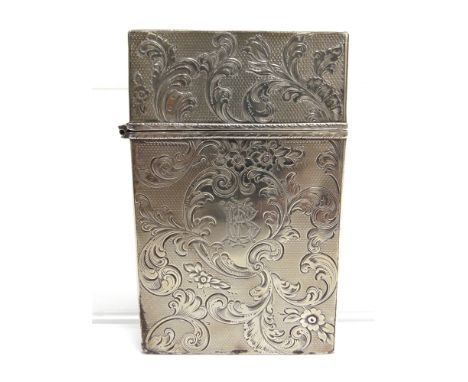 AN EARLY VICTORIAN SILVER CARD CASE profusely engraved all over with foliate scrolls and a cartouche on an engine turned grou