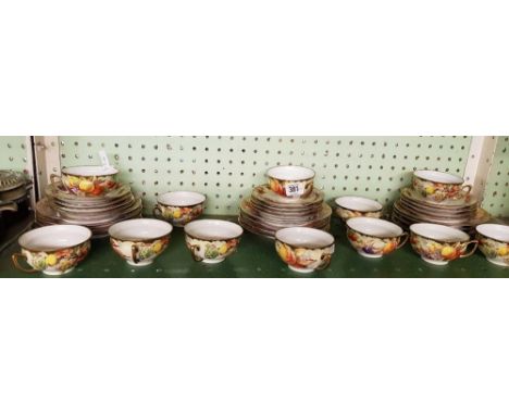 SHELF OF FRUIT PATTERNED CUPS & SAUCERS & SANDWICH PLATES