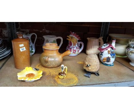 SHELF OF MISC JUGS, GLAZED INK JAR & A BEEHIVE CANDLE