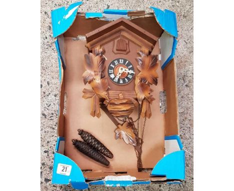 CARTON WITH A BLACK FOREST CUCKOO CLOCK
