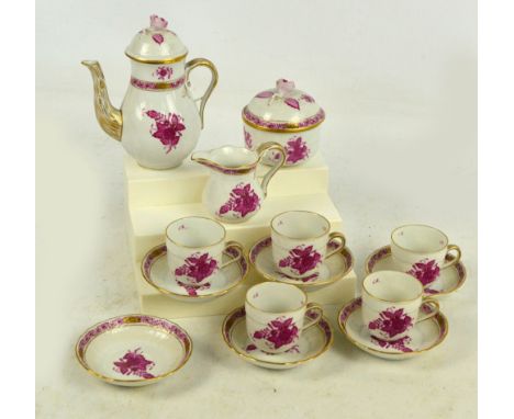 A Herend floral decorated gilt heightened cream ground coffee set comprising lidded coffee pot, lidded sugar bowl, jug, six s