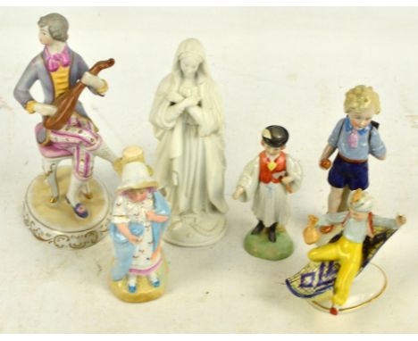 A Hollohaza of Hungary porcelain figure of a seated man playing a lute, height 24cm, a bisque porcelain figure, a Herend figu