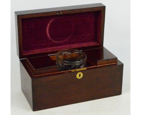 A 19th century mahogany rectangular tea caddy of simple form, the hinged lid enclosing two lidded compartments and a central 