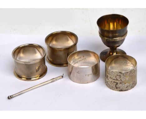 A pair of Elizabeth II hallmarked silver circular napkin rings with overall engine turned decoration and initialled rectangul