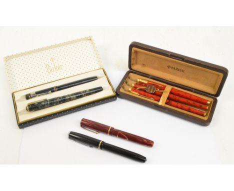 A collection of vintage pens comprising a patterned Wyvern number 5C fountain pen with 14ct nib, a black textured Onoto The P