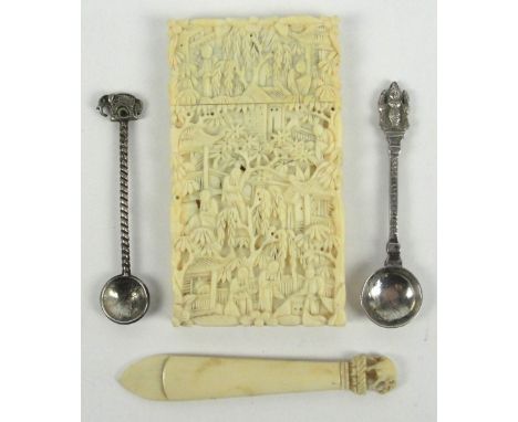 A late 19th century Canton carved ivory card case decorated with figures amongst buildings and trees, height 8.5cm, an ivory 