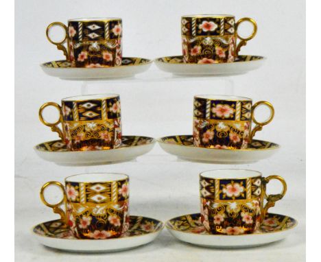 A set of six Royal Crown Derby 2451 pattern coffee cans and saucers.