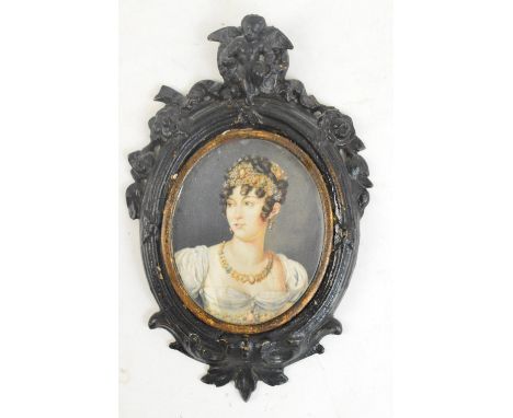 JB DELEROY; a 19th century oval miniature portrait on ivory depicting a bust of a young woman in gold pearl and gemstone tiar