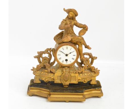 A late 19th century French gilt spelter figural mantel clock with drum type movement and white dial set with Roman numerals r