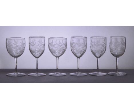 JAMES POWELL WHITEFRIARS; a set of four port/sherry glasses with engraving attributed to Hillebauer, the bowls decorated with