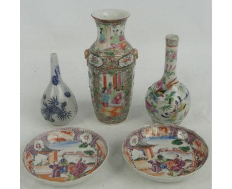 A late 19th century Chinese Canton porcelain vase of baluster form with twin gilt handles painted with four panels depicting 