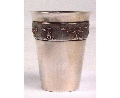 A 20th century Vietnamese silver beaker of tapering form, decorated with cast band depicting architectural and figural landsc