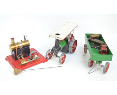 A boxed Mamod SE.2A steam engine, a boxed Mamod steam tractor, a trailer, two small model anvils and a vice.