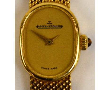 JAEGER-LECOULTRE; an 18ct yellow gold cased manual wind lady's wristwatch, the oval dial set with maker's name, with tiger's 