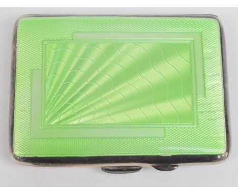 An Edward VIII hallmarked silver green guilloche enamel decorated cigarette case of rounded rectangular form, with gilt wash 