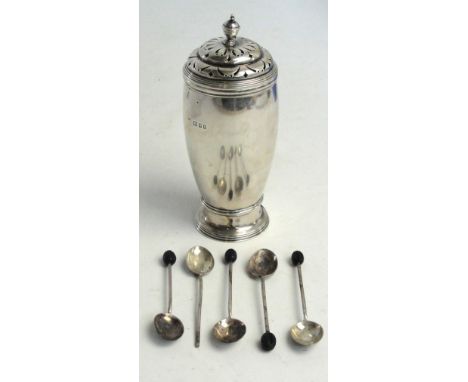 A George V hallmarked silver sugar shaker of ovoid form with pierced stepped cover with cast finial on spreading circular foo