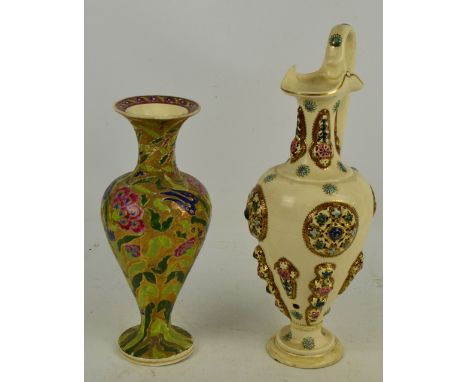 FISCHER OF BUDAPEST; a large cream ground ewer with raised pierced decoration and high lop handle, height 47.5cm, and a flora