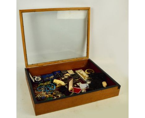 A lap display cabinet containing a quantity of costume jewellery and collectable items including a Charles Horner hat pin, lo