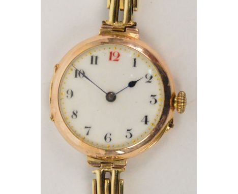 An early 20th century 9ct yellow gold cased manual wind lady's wristwatch, the circular dial set with Arabic numerals, case h