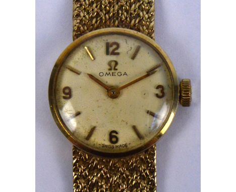 OMEGA; a 1960s 9ct yellow gold cased manual wind lady's wristwatch, the circular dial set with applied Arabic and baton numer