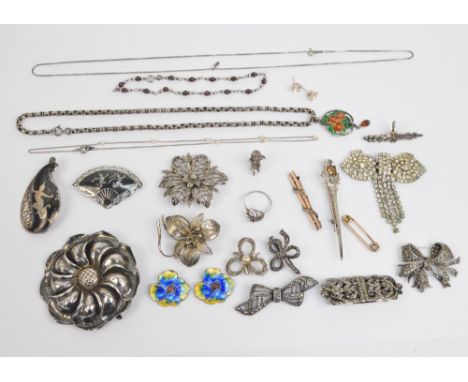 A collection of various silver and white metal brooches, predominantly set with marcasite, also a 9ct rose gold bar brooch se