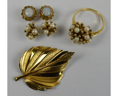 A 9ct yellow gold leaf shaped brooch, length 4cm, and a 9ct gold and pearl set ring of organic form, size O 1/2, a matching p