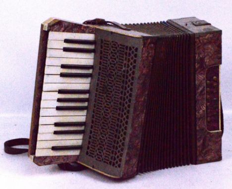 A Mastertone piano accordion (af).